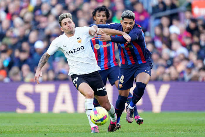 Ronald Araujo pictured (right) fouling Hugo Duro during Barcelona's 1-0 win over Valencia